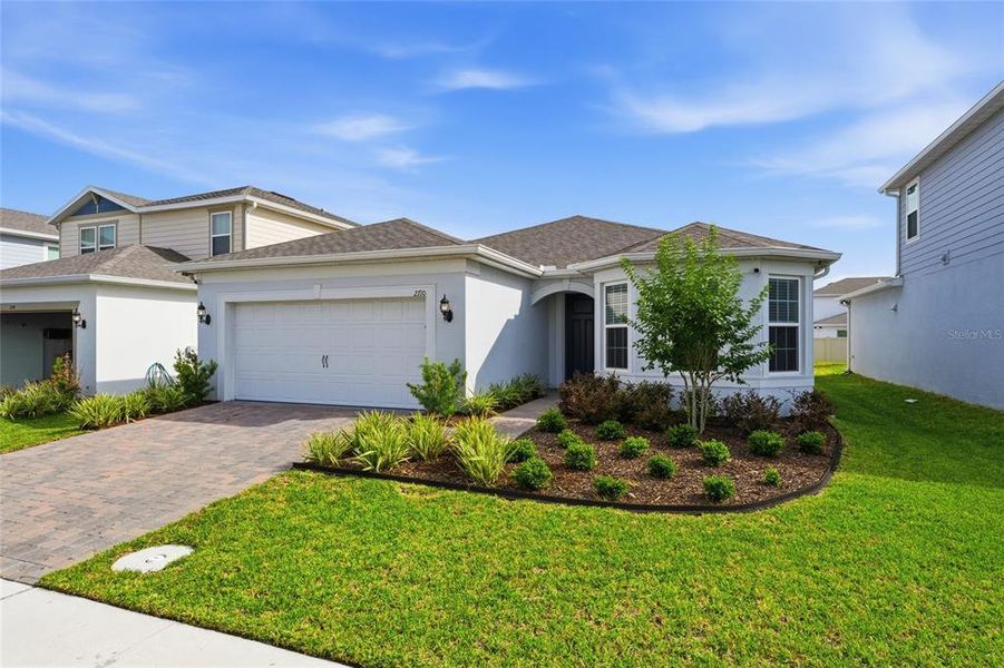 Front exterior of a new home in , Kissimmee, FL, highlighting curb appeal (Image 25).