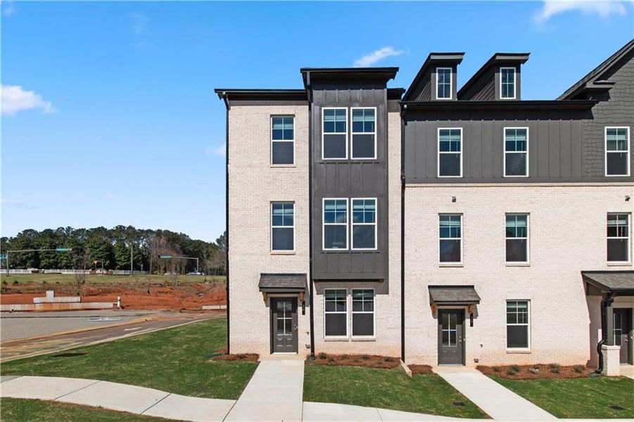 Front exterior of a new home in Daybreak, Newnan, GA, highlighting curb appeal (Image 17). Front exterior of a new home in Daybreak, Newnan, GA, highlighting curb appeal (Image 17).