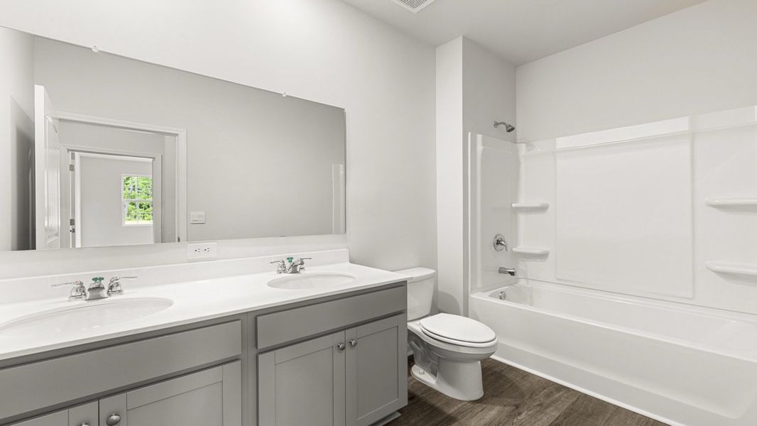 Representative furnished interior of a home built from the Booth by D.R. Horton in Liberty Crossing, Braselton (Image 14).