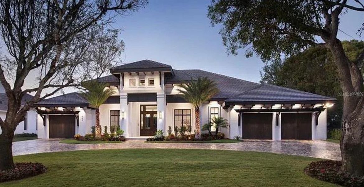 Front exterior of a new home in , Apollo Beach, FL, highlighting curb appeal (Image 1).