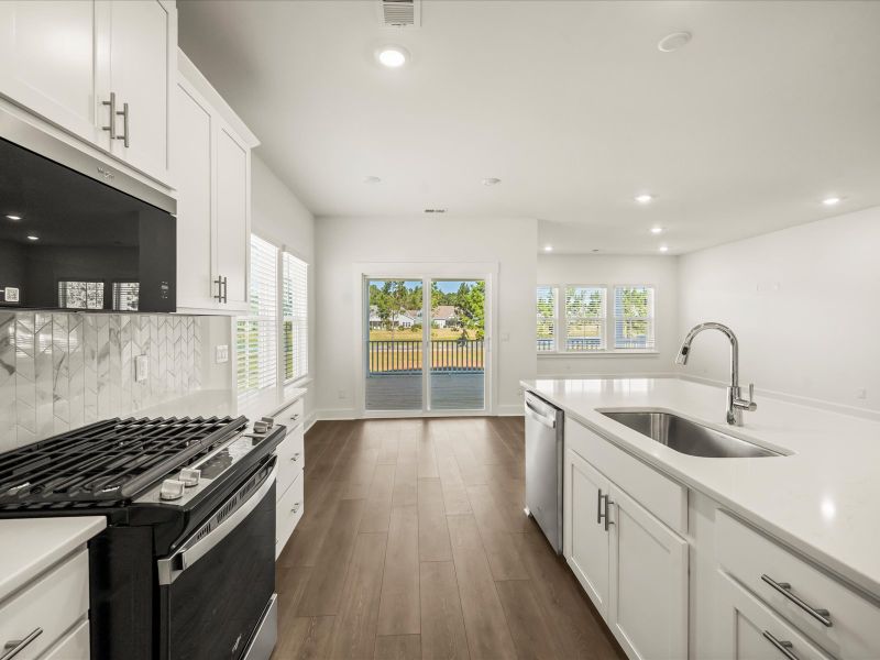 Furnished interior view inside a new home in The Coves at Lakes of Cane Bay, Summerville (Image 6).
