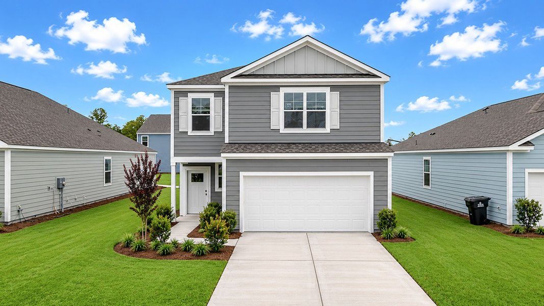 Front exterior of a new home in Hillcrest, Ravenel, SC, highlighting curb appeal (Image 1). Front exterior of a new home in Hillcrest, Ravenel, SC, highlighting curb appeal (Image 1).
