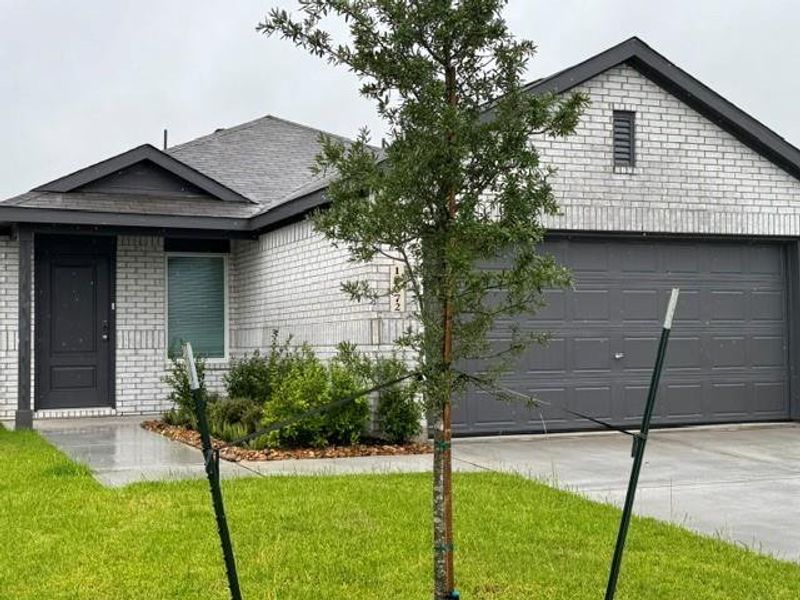 Front exterior of a new home in , New Caney, TX, highlighting curb appeal (Image 1). Front exterior of a new home in , New Caney, TX, highlighting curb appeal (Image 1).