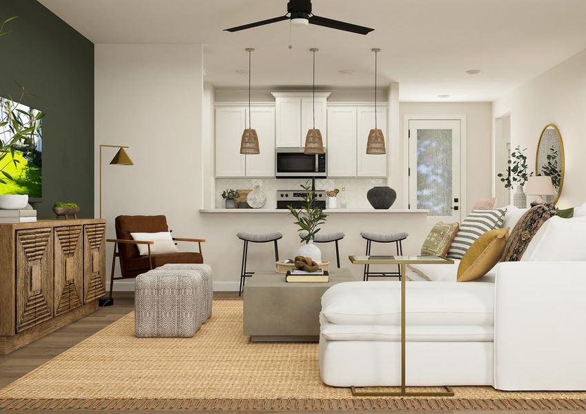 Rendering showing the open floor plan of
  the Houghton. The living room is in front of the kitchen, which has white
  cabinetry.