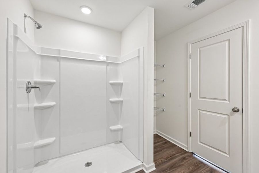 A bathroom with a tub and sink. A bathroom with a tub and sink.
