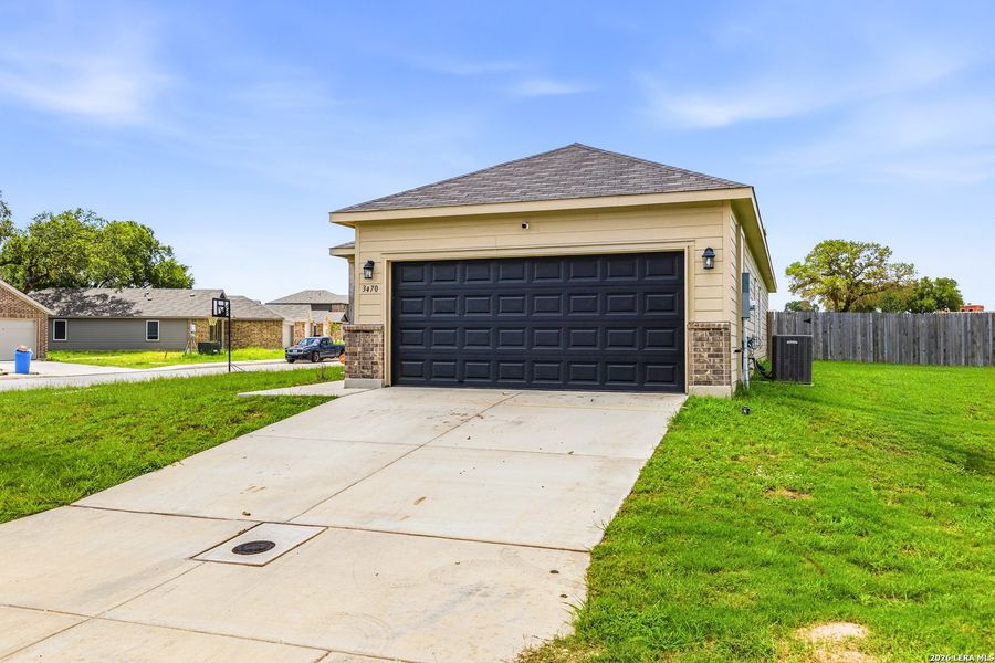 Front exterior of a new home in Lonesome Dove, San Antonio, TX, highlighting curb appeal (Image 21).