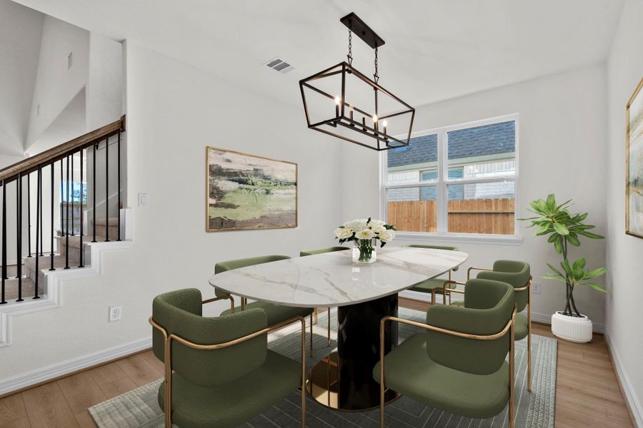 The dining area is a perfect blend of style and functionality, providing an inviting space for memorable meals and gatherings.