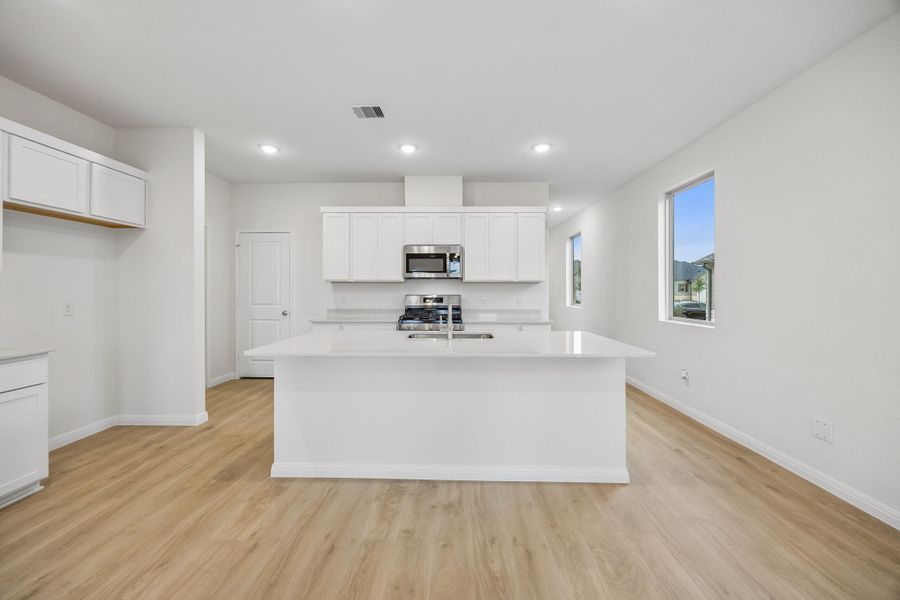Kitchen in the Magnolia home plan by Trophy Signature Homes – REPRESENTATIVE PHOTO