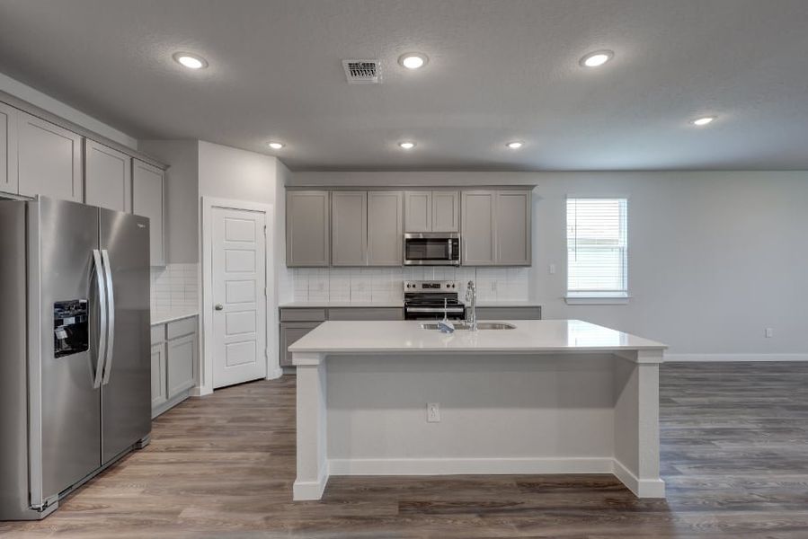 A kitchen with white cabinets. A kitchen with white cabinets.