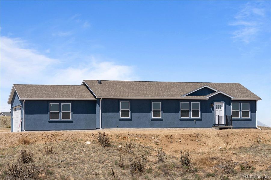 Front exterior of a new home in , Fountain, CO, highlighting curb appeal (Image 25).
