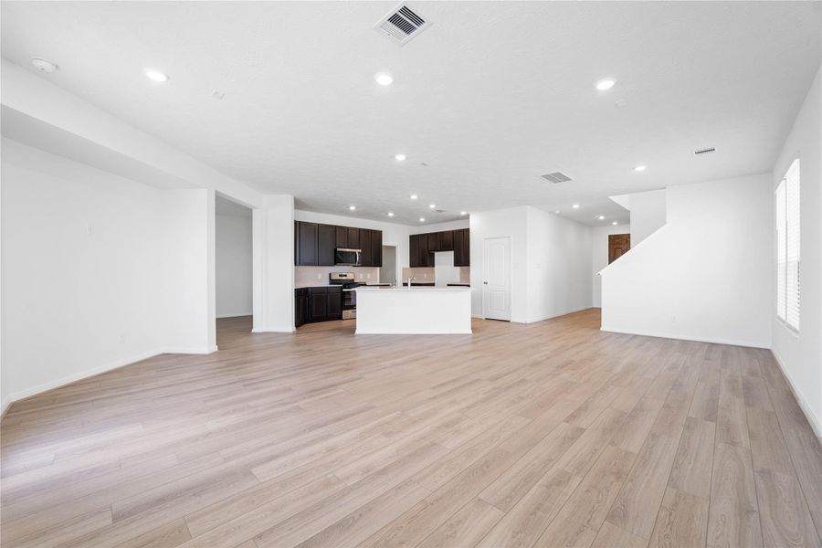 Stunning open-concept design seamlessly connecting the living, dining, and kitchen areas—perfect for both everyday living and entertaining! Stunning open-concept design seamlessly connecting the living, dining, and kitchen areas—perfect for both everyday living and entertaining!