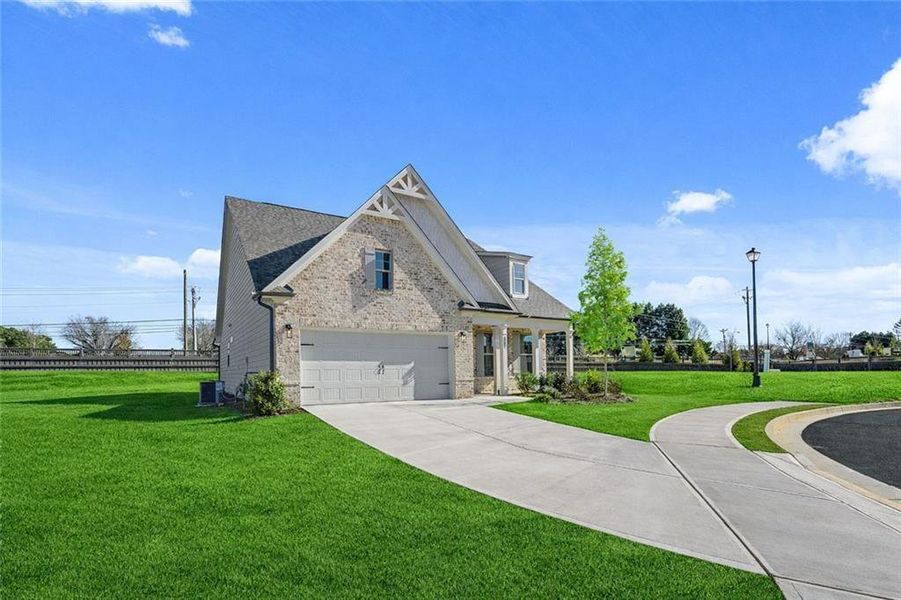 Front exterior of a new home in Soleil Summit Chase, Snellville, GA, highlighting curb appeal (Image 2).