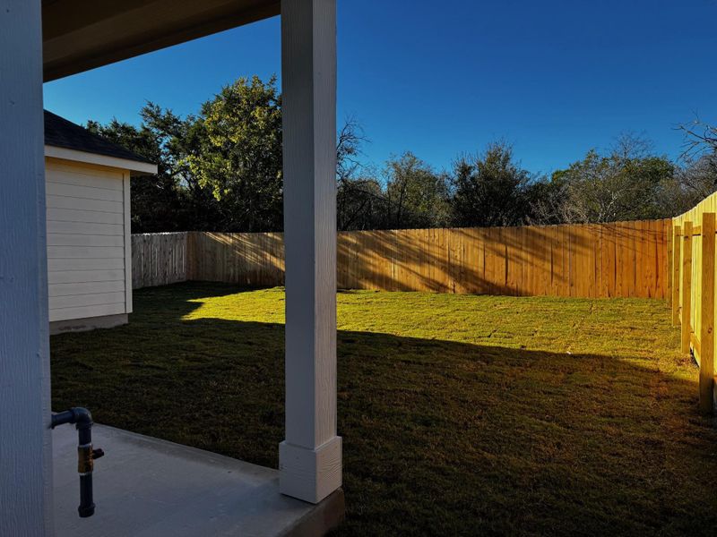 View of fenced backyard