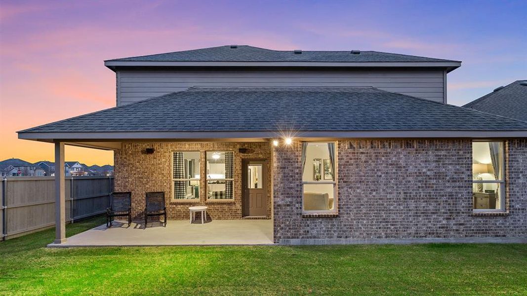 Rear Elevation and covered back Patio - All Home and community information, including pricing, included features, terms, availability and amenities, are subject to change at any time without notice or obligation. All Drawings, pictures, photographs, video, square footages, floor plans, elevations, features, colors and sizes are approximate for illustration purposes only and will vary from the homes as built.