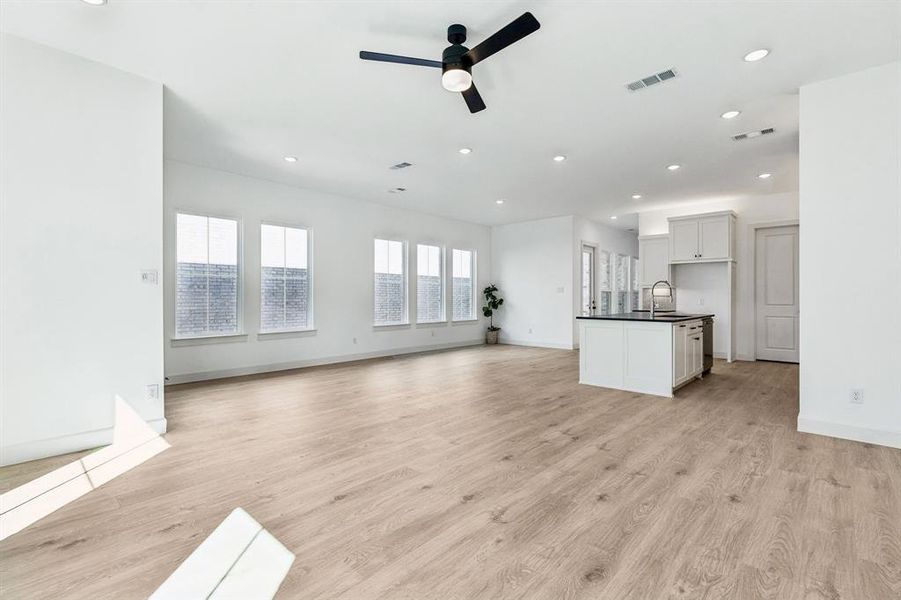 Whether it's lively dinner parties or cozy family get togethers, this light filled family-dining-kitchen area is the perfect place for you to entertain.