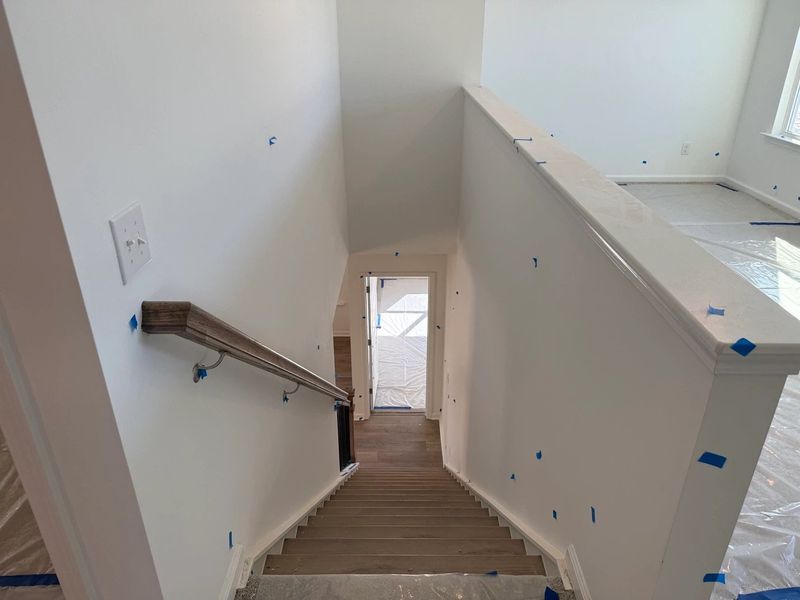 Staircase featuring the AW Collection® Timeless - Classic rails and trim add graceful detail.