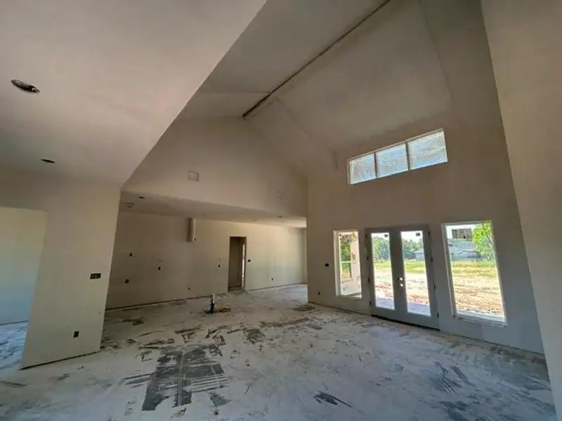 Vaulted ceiling with transom windows and double French doors Vaulted ceiling with transom windows and double French doors