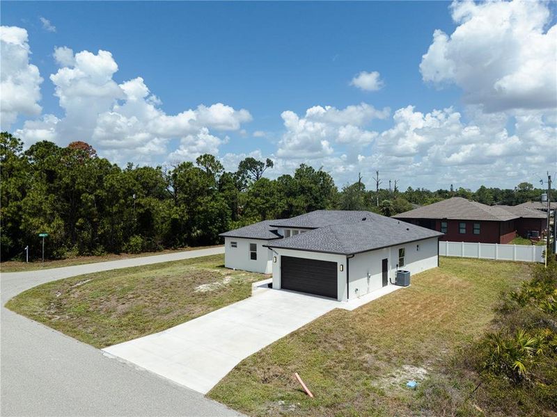 Front exterior of a new home in , Port Charlotte, FL, highlighting curb appeal (Image 2). Front exterior of a new home in , Port Charlotte, FL, highlighting curb appeal (Image 2).