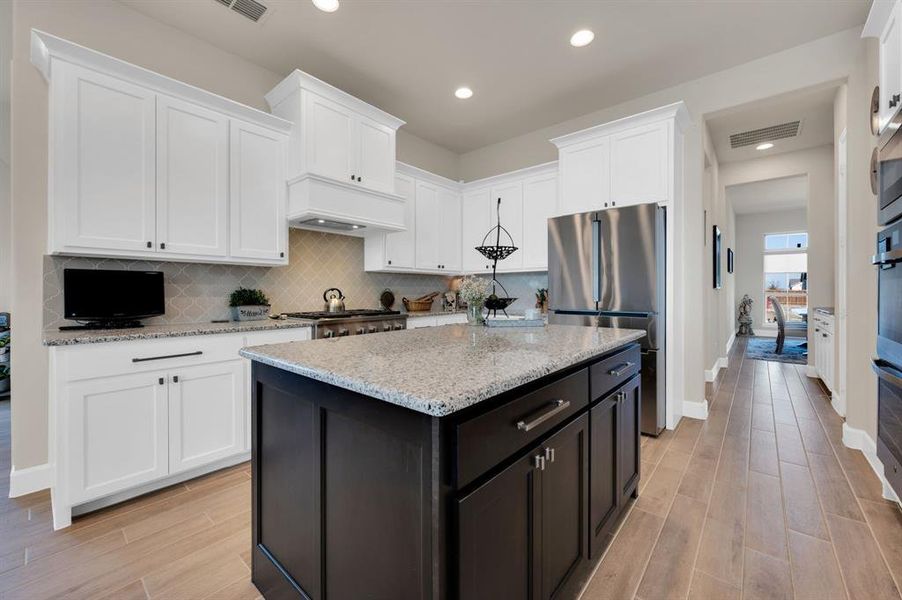 Island with storage on both sides offers even more space for kitchenware.