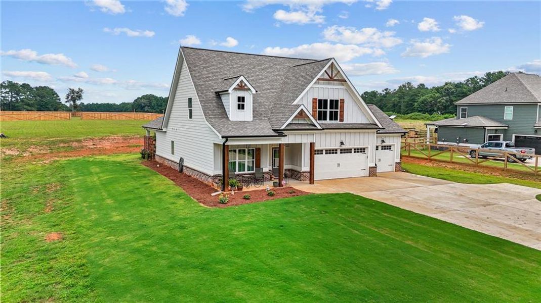 Front exterior of a new home in , Covington, GA, highlighting curb appeal (Image 2). Front exterior of a new home in , Covington, GA, highlighting curb appeal (Image 2).