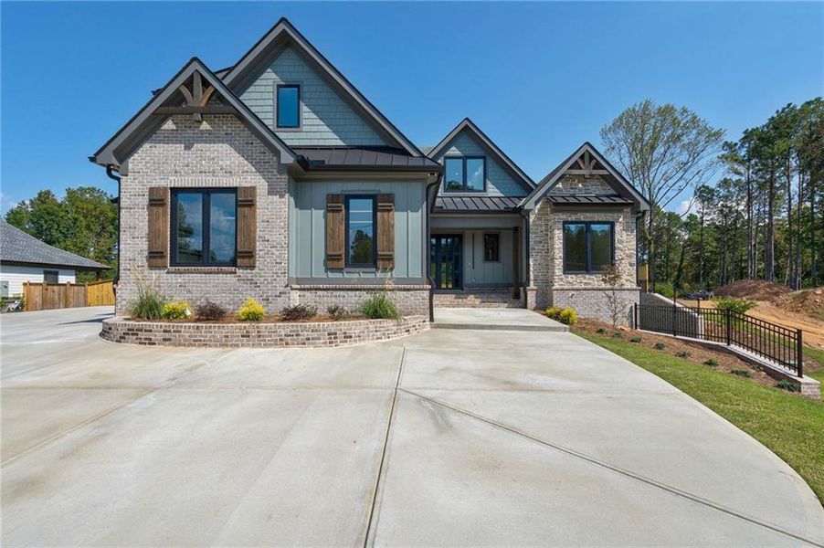 Front exterior of a new home in , Sugar Hill, GA, highlighting curb appeal (Image 34).