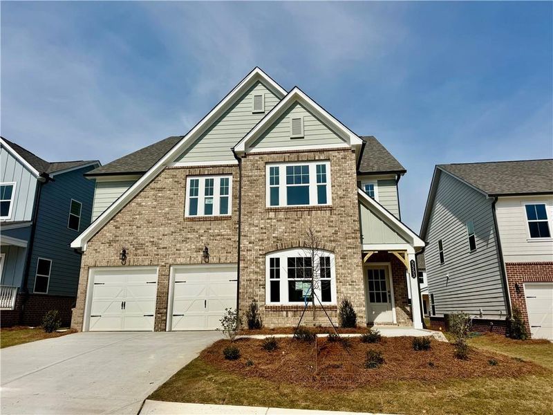 Front exterior of a new home in Eastlyn Crossing, Flowery Branch, GA, highlighting curb appeal (Image 9).