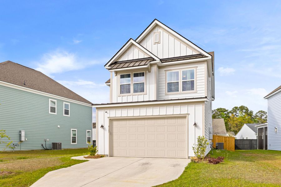 Front exterior of a new home in , Charleston, SC, highlighting curb appeal (Image 26).