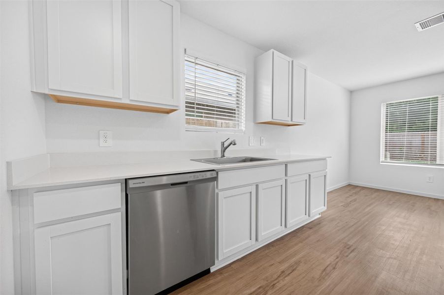 Big white cabinets complement the house perfectly. Big white cabinets complement the house perfectly.