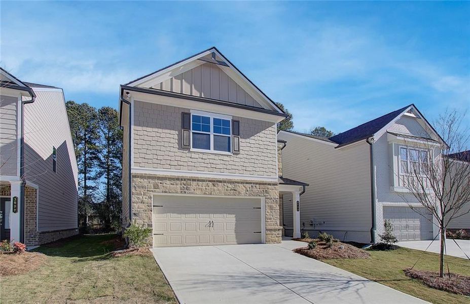 Front exterior of a new home in Crofton Place Enclave, Snellville, GA, highlighting curb appeal (Image 19).
