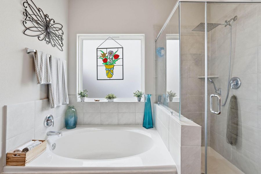 Large soaking tub and separate shower in primary bath