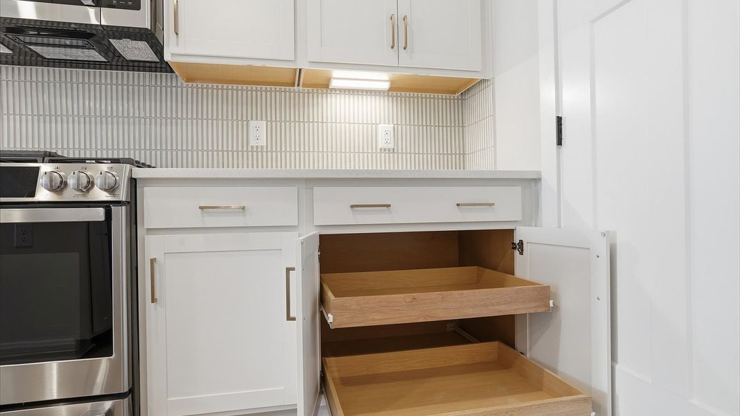Chef-ready kitchen with abundant storage and stainless steel appliances by DRB Homes Chef-ready kitchen with abundant storage and stainless steel appliances by DRB Homes