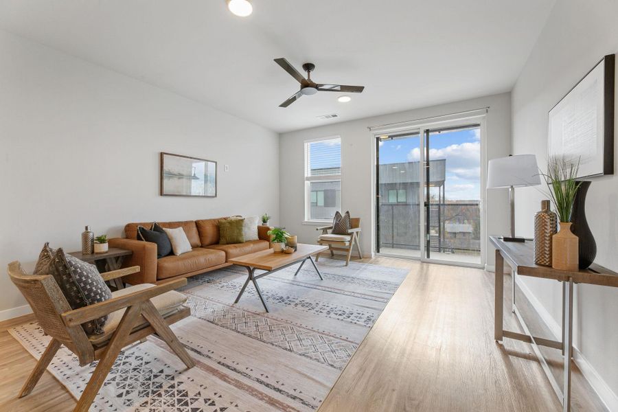 Living area with ceiling fan, recessed lighting, and light wood-type flooring