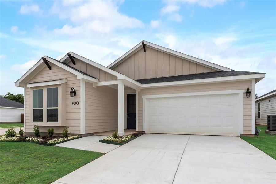 Front exterior of a new home in Creekside of Crowley, Crowley, TX, highlighting curb appeal (Image 2). Front exterior of a new home in Creekside of Crowley, Crowley, TX, highlighting curb appeal (Image 2).