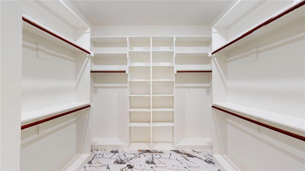 Spacious closet with marble finish floor