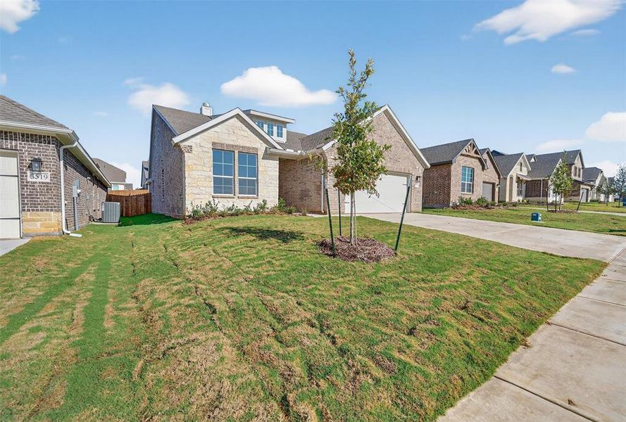 Front exterior of a new home in Liberty Pointe, Gainesville, TX, highlighting curb appeal (Image 20).