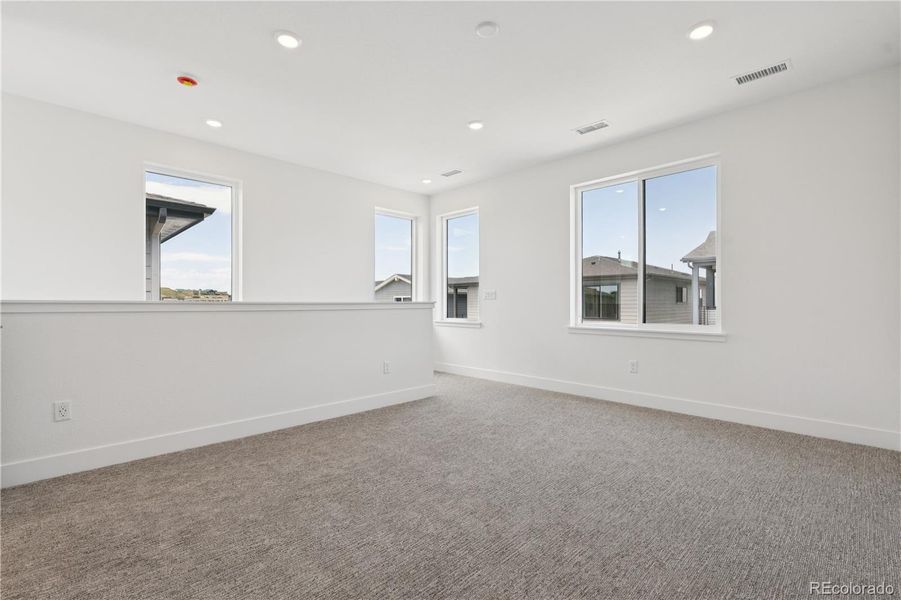 Spacious, unfurnished interior of a new home in Storytellers at Lyric, Lone Tree (Image 47).