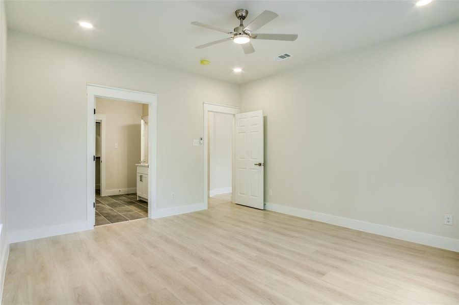 Unfurnished bedroom featuring recessed lighting, baseboards, visible vents, and light wood-type flooring