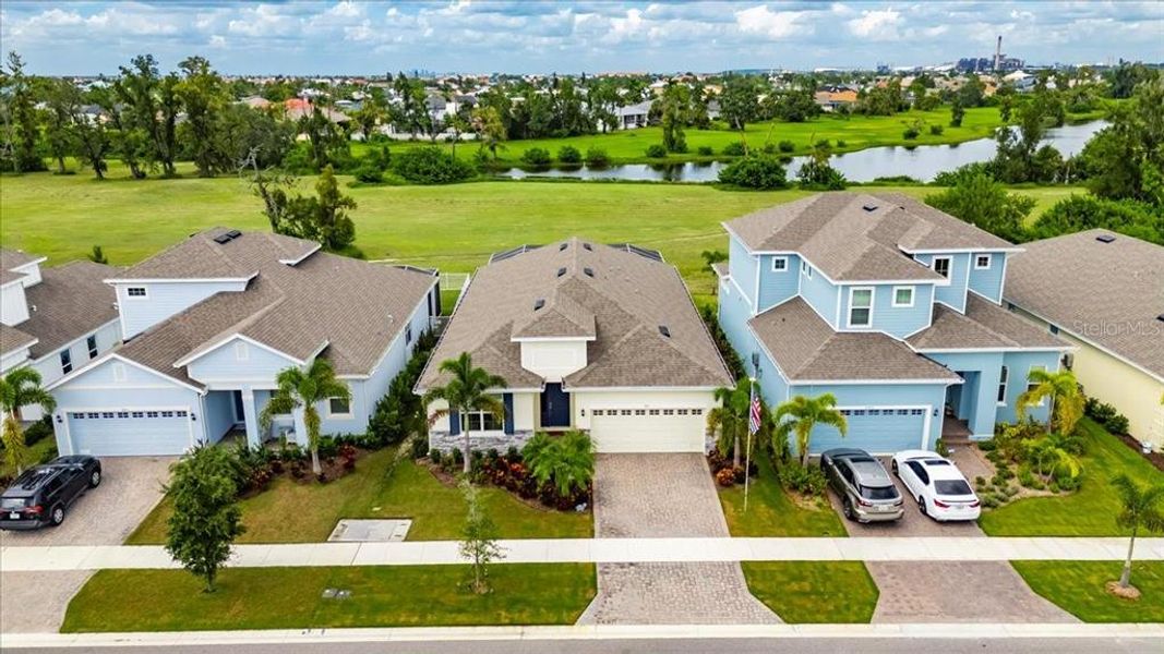 Front exterior of a new home in Marisol Pointe at MiraBay Florida Series, Apollo Beach, FL, highlighting curb appeal (Image 21).