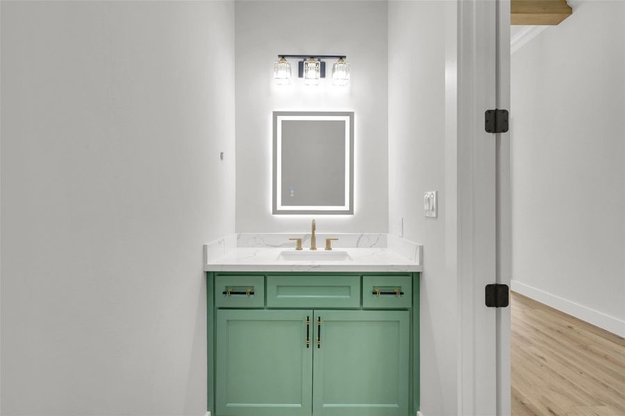 Conveniently placed powder room keeps guest access easy and private Conveniently placed powder room keeps guest access easy and private