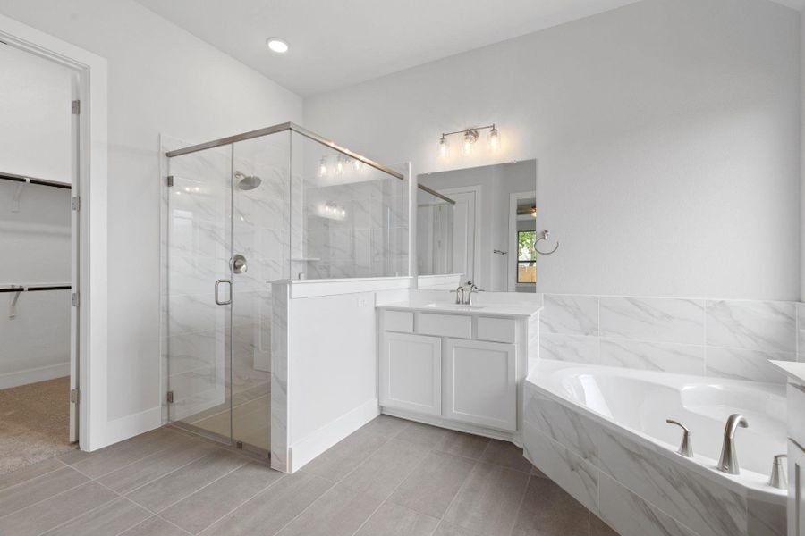 Primary Bath retreat with dual vanities & garden tub & walk-in shower Primary Bath retreat with dual vanities & garden tub & walk-in shower