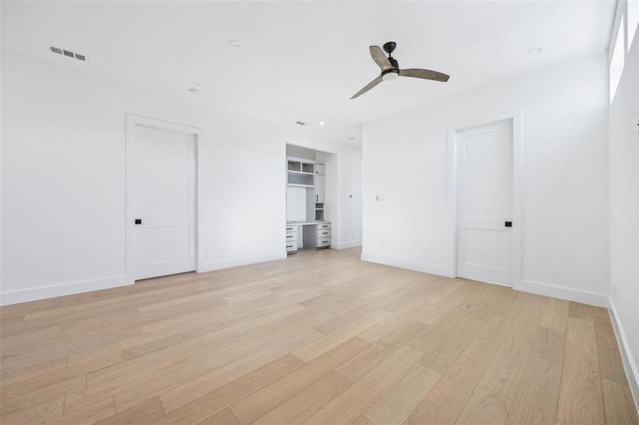 Upstairs game room with built in desk and powder bathroom. Upstairs game room with built in desk and powder bathroom.