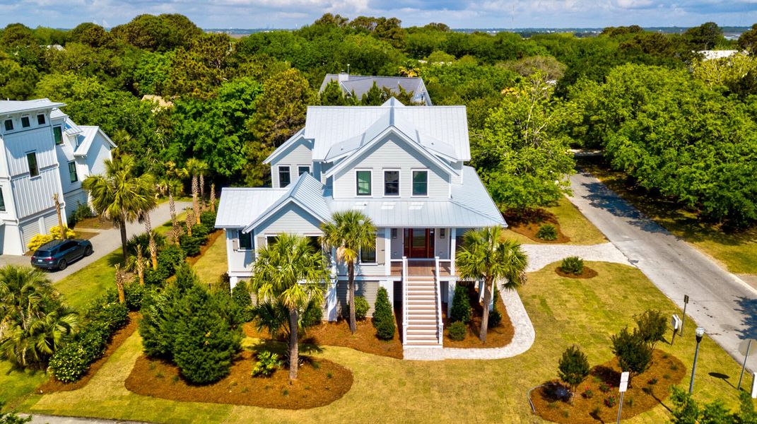 Front exterior of a new home in , Sullivan's Island, SC, highlighting curb appeal (Image 1).