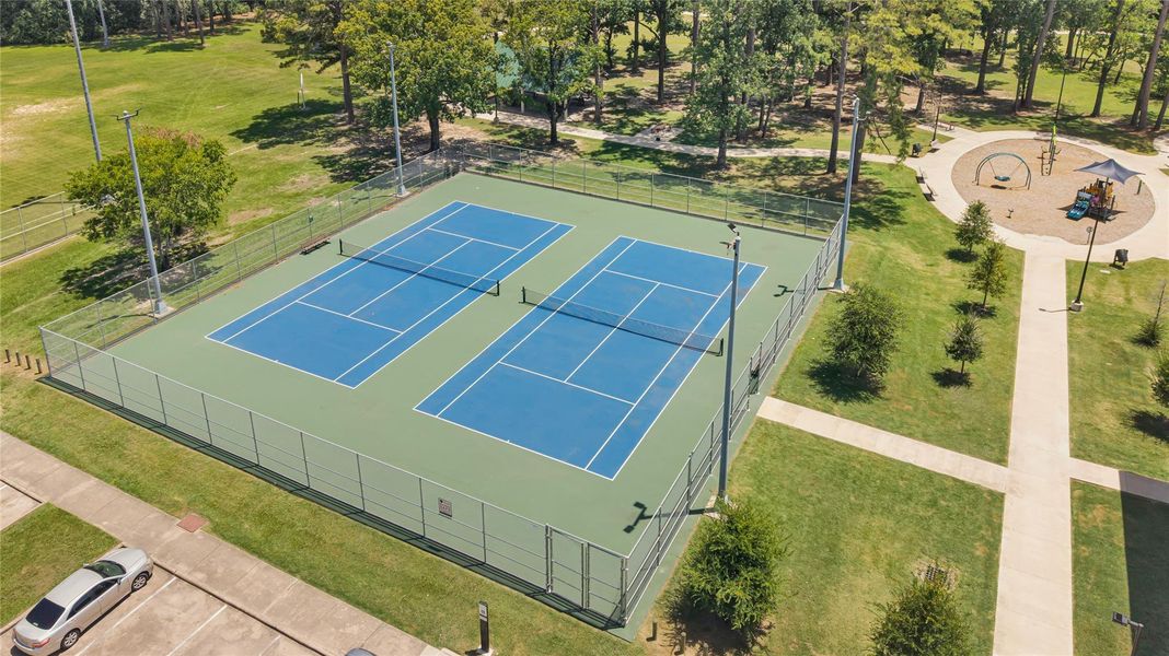 Resort-style community amenity area featuring recreational spaces. Resort-style community amenity area featuring recreational spaces.