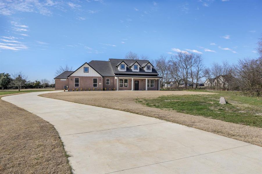 Front exterior of a new home in , Farmersville, TX, highlighting curb appeal (Image 26).