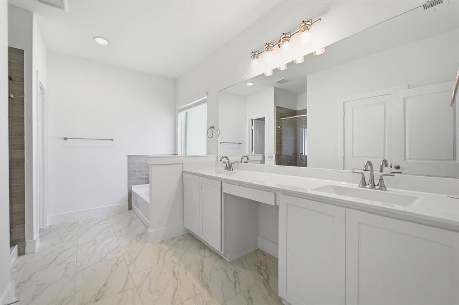 Dual white vanities with integrated sinks and chrome fixtures