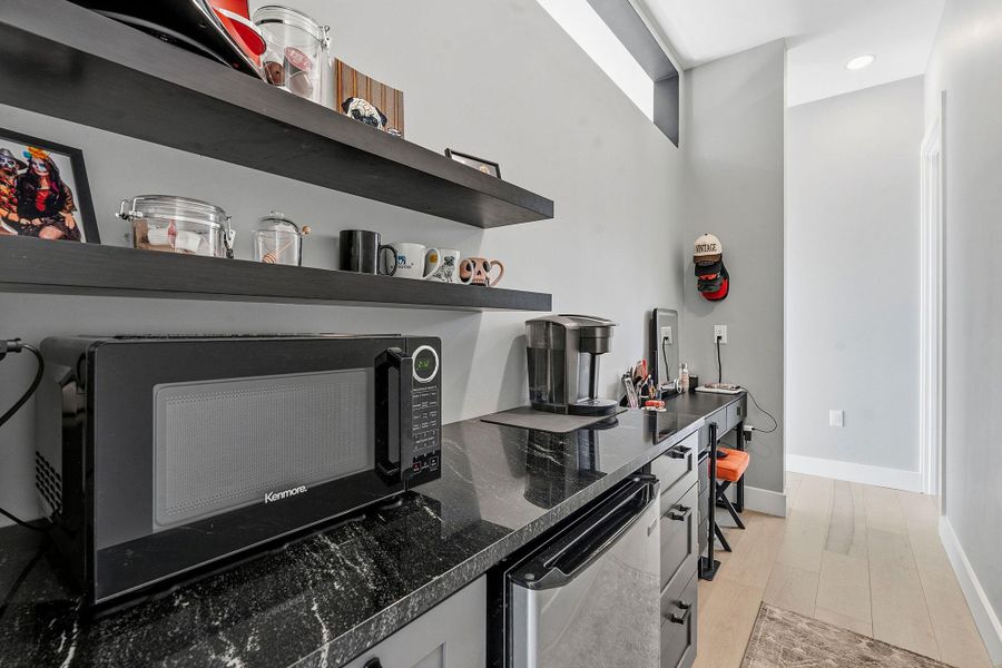 Coffee bar and sit down vanity area in primary bedroom