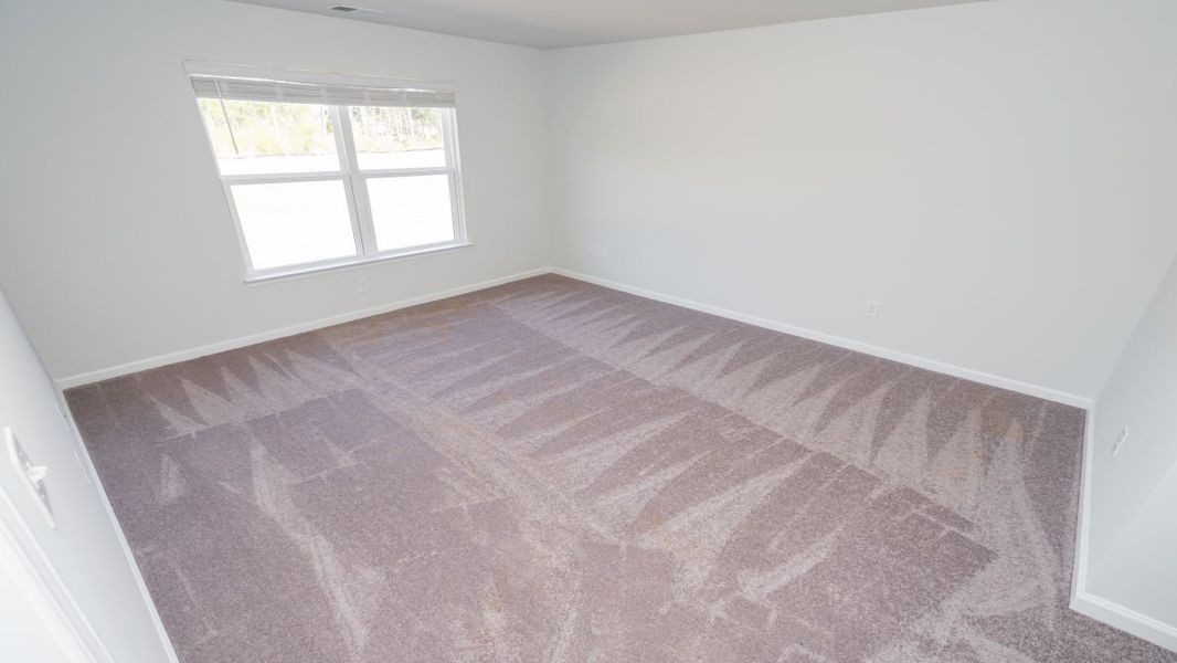 Representative unfurnished interior of a home built from the ARIA by D.R. Horton in Stanbury Creek, Supply (Image 23).