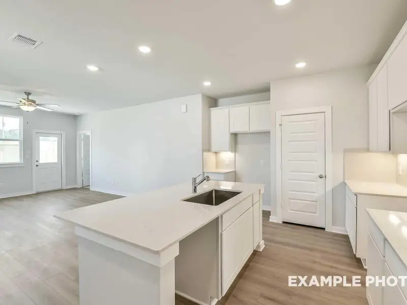 Furnished interior view inside a new home in Caney Creek Place, Conroe (Image 5).