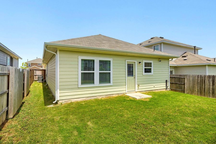 A fenced backyard offers a secure and spacious outdoor area for household activities and private enjoyment. A fenced backyard offers a secure and spacious outdoor area for household activities and private enjoyment.