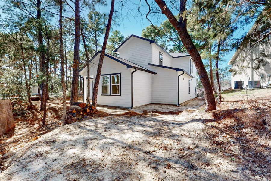 Front exterior of a new home in , Bastrop, TX, highlighting curb appeal (Image 16).